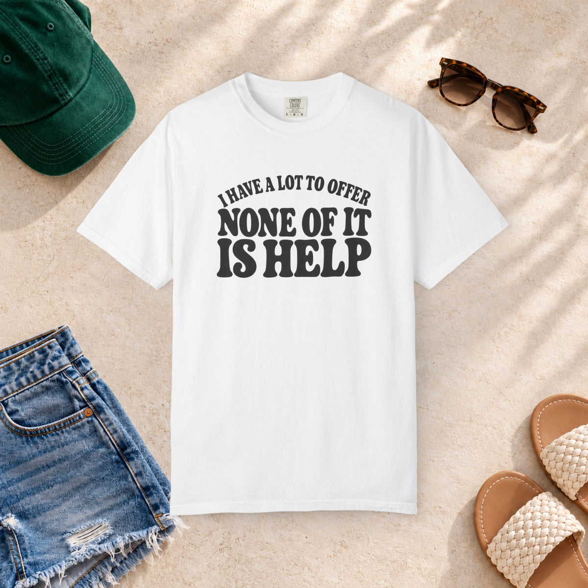 Comfort Colors T-shirt with bold retro “I Have a Lot to Offer, None of It Is Help” lettering