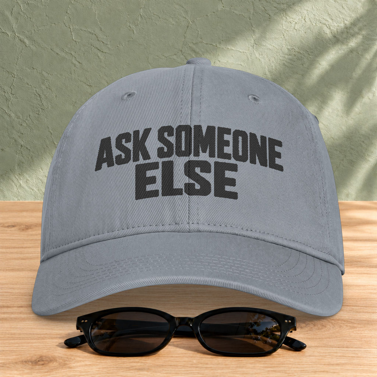 Ask Someone Else washed cap in Granite, front view with slogan lettering