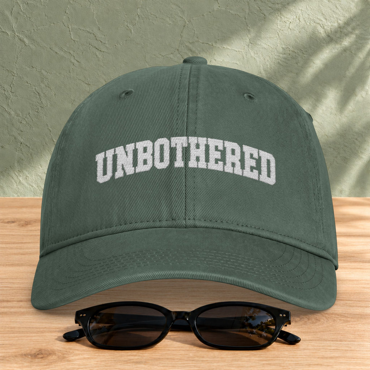 Unbothered Embroidered Washed Cap in Moss — product view