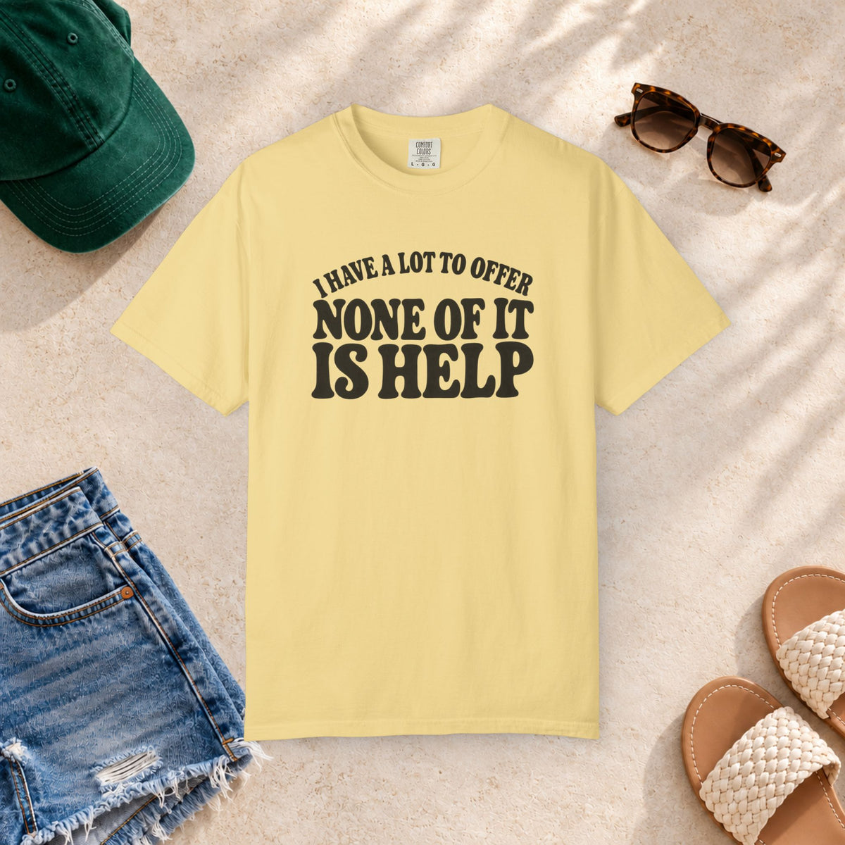 Comfort Colors T-shirt with bold retro “I Have a Lot to Offer, None of It Is Help” lettering