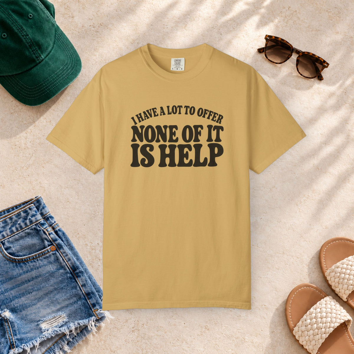 Comfort Colors T-shirt with bold retro “I Have a Lot to Offer, None of It Is Help” lettering