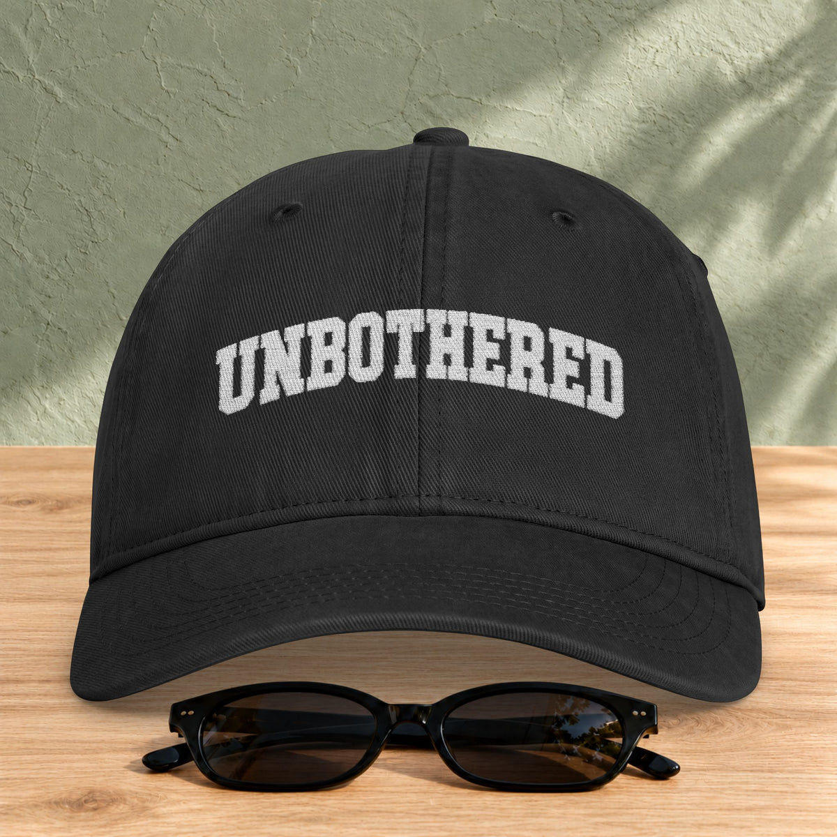 Unbothered Embroidered Washed Cap in Black — product view
