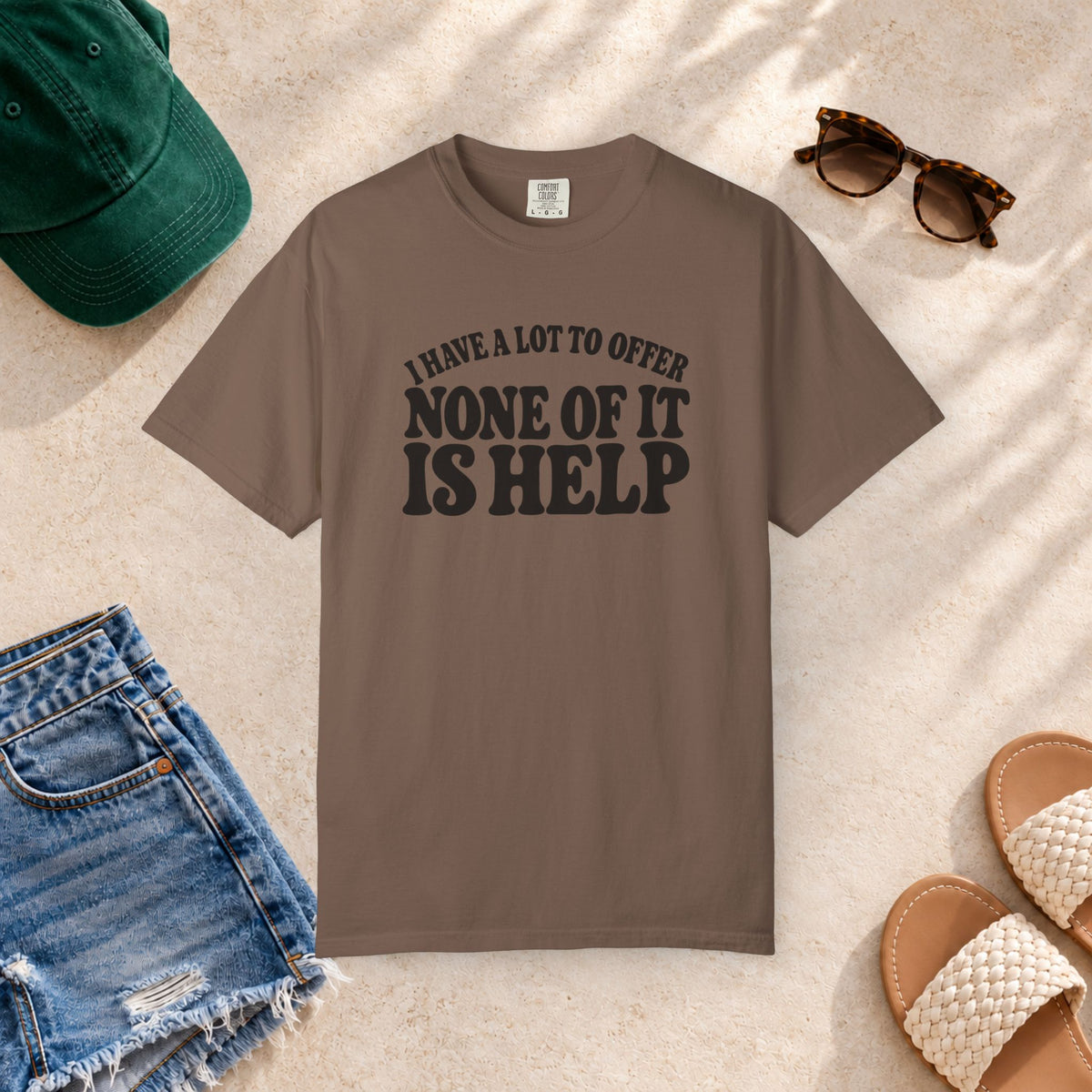 Comfort Colors T-shirt with bold retro “I Have a Lot to Offer, None of It Is Help” lettering